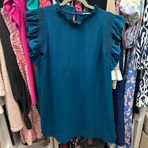 Darling feminine ruffle mini dress. Vibrant jewel toned teal.